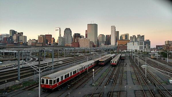 overhead image of a train moving through a city