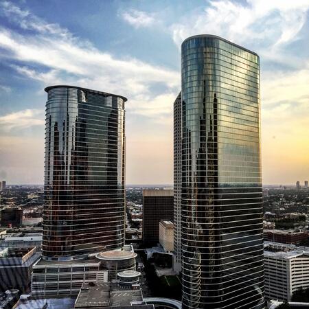 image of a city skyline with two skyscrapers in the foreground