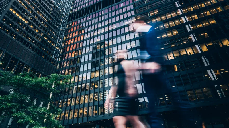 man standing in front of a building