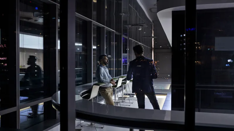 image of two men talking