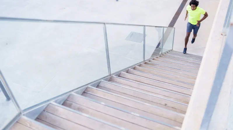 image of man walking upstairs