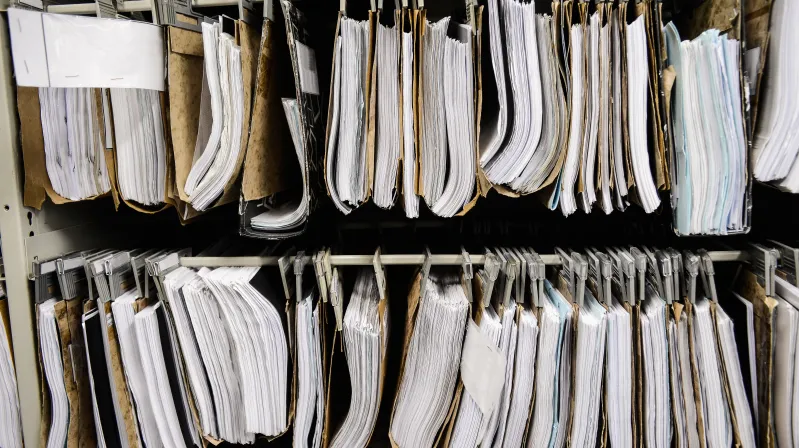 Image of piles of paper hanging