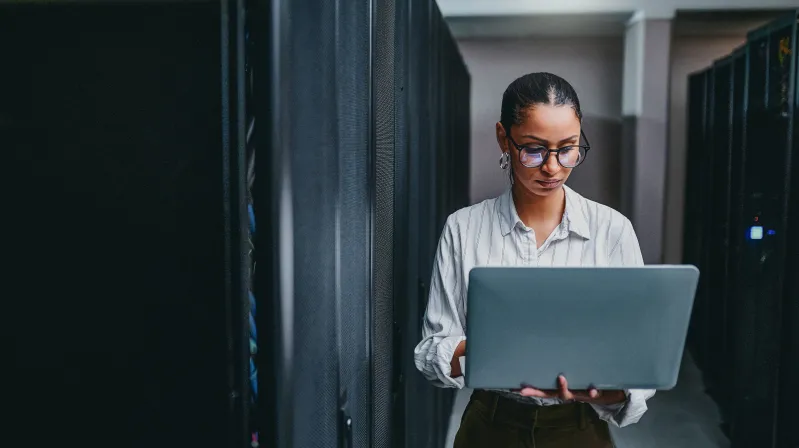 image of woman holding computer
