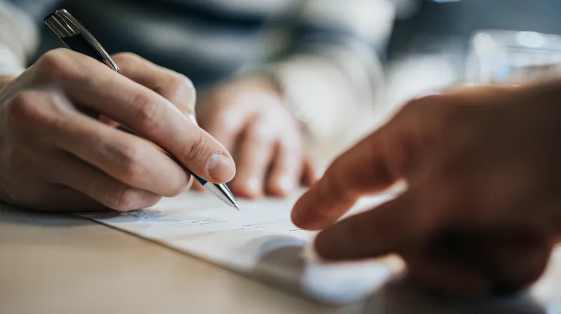 screenshot of the first page of Image of hand and pen