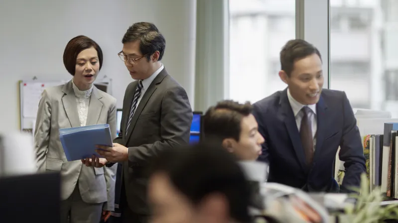 image of people discussing finance