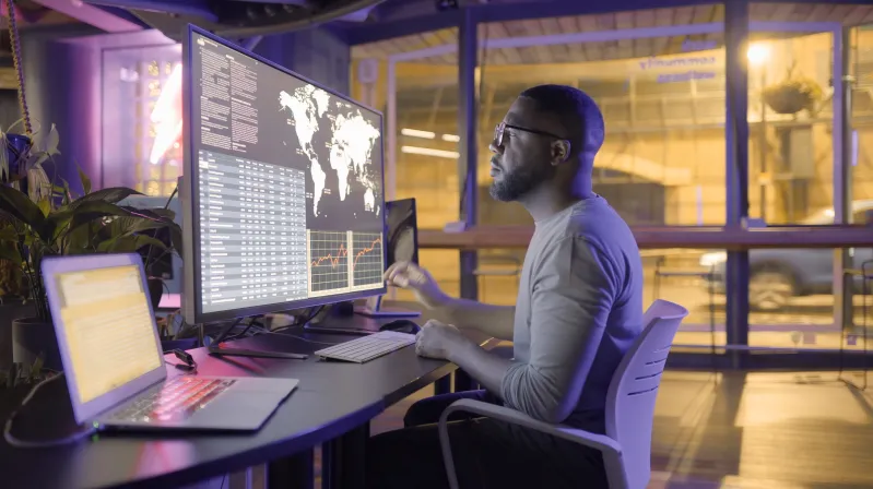 Image of a man looking at the large screen
