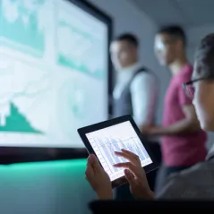 Image of People Looking at a Screen