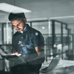 man holding a computer