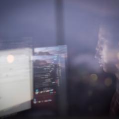 image of man looking at computer screen