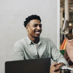 image of man smiling in a meeting