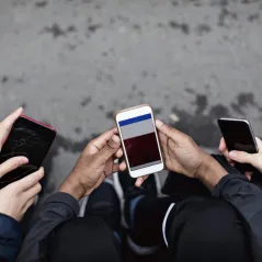 image of people on their phones