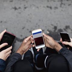 image of people on their phones