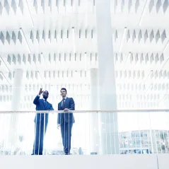 image of two men talking on a bridge