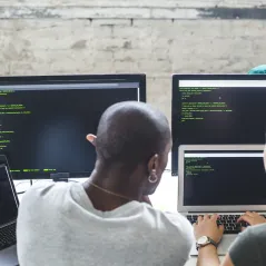 image of man and woman looking at computer screen