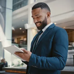 image of man looking at ipad