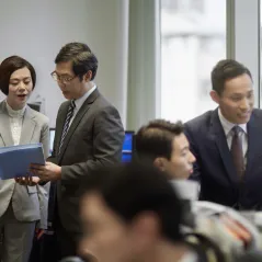 image of people discussing finance